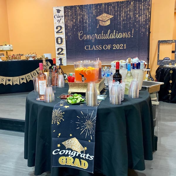 A graduation party setup with drinks, snacks, and "Class of 2021" decorations at Yak and Yeti Himalayan Cuisine.